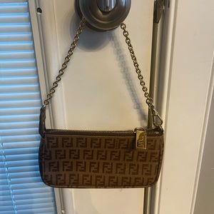 Fendi Bag! Little in size ( fits my iPhone 13) but big in style. Timeless.